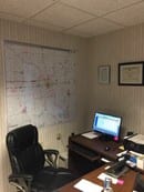 Office with a map on the wall